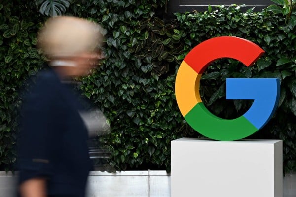 A woman walks past a Google logo at the company’s campus in Warsaw in February 2025. Photo: AFP A woman walks past a Google logo at the company’s campus in Warsaw in February 2025. Photo: AFP
