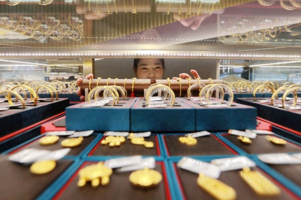Many rich Chinese families aim to increase their gold holdings this year as risk appetite continues to contract. Photo: Xinhua Many rich Chinese families aim to increase their gold holdings this year as risk appetite continues to contract. Photo: Xinhua