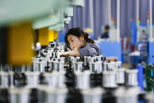 A worker is seen on a wire harness production line at an electronics factory in Shangqiu, a city in central Henan province, on January 27, 2026. Photo: Xinhua