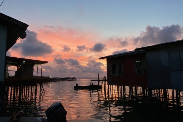 A fisherman goes out in his boat in Semporna, Sabah, Malaysia. Photo:  Ushar Daniele