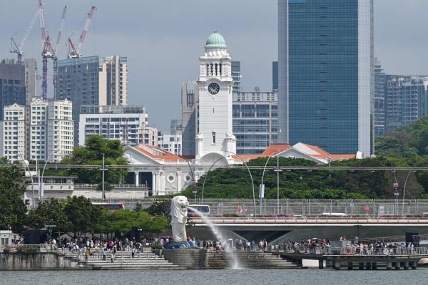 People gather around the Merlion statue at Marina Bay in Singapore. Photo: AFP People gather around the Merlion statue at Marina Bay in Singapore. Photo: AFP