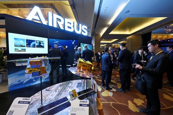 Visitors check out the Airbus booth at the Space Summit in Singapore on Monday. Photo: Reuters