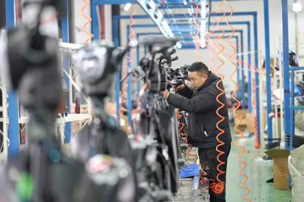 An employee works on a production line at a motorcycle company in Tongren city, in southwest China’s Guizhou province, on January 27. As part of its industrial upgrading, China must direct sustained state financing to support semiconductor ecosystems, advanced manufacturing and strategic technologies. Photo: Xinhua