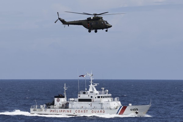A Philippine coastguard vessel sails in disputed waters of the South China Sea during a maritime drill. Photo: EPA-EFE