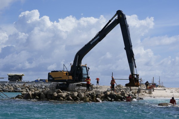 Construction takes place on the Philippine-occupied Thitu island, locally called Pagasa, in November 2024. Photo: AP 