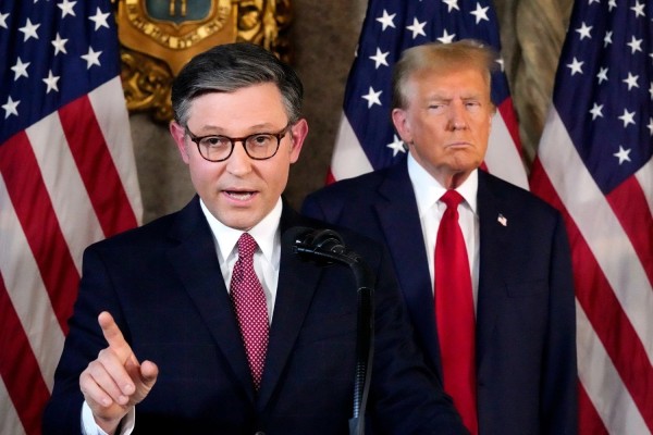House Speaker Mike Johnson (left) has repeatedly used procedural tactics to shield President Donald Trump from votes challenging his tariff policies, helping preserve Republican unity despite growing dissent. Photo: AP
