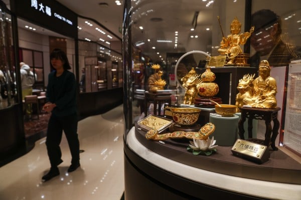 Decorative items made of gold are displayed at a jewellery store in Beijing on January 28. Photo: EPA-EFE Decorative items made of gold are displayed at a jewellery store in Beijing on January 28. Photo: EPA-EFE