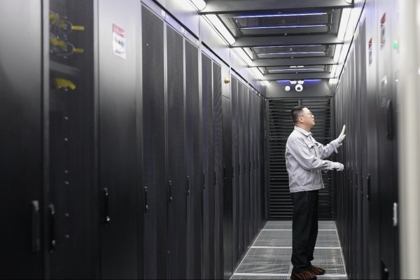An employee conducts maintenance in a server room of the China Mobile Hohhot Data Centre in Hohhot in Inner Mongolia. Photo: Xinhua