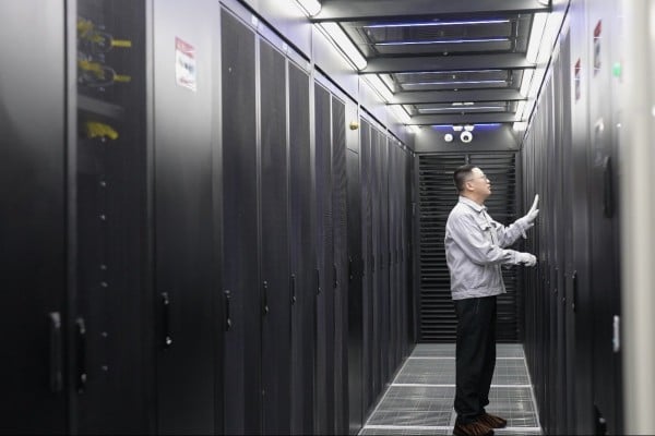 An employee conducts maintenance in a server room of the China Mobile Hohhot Data Centre in Hohhot in Inner Mongolia. Photo: Xinhua An employee conducts maintenance in a server room of the China Mobile Hohhot Data Centre in Hohhot in Inner Mongolia. Photo: Xinhua