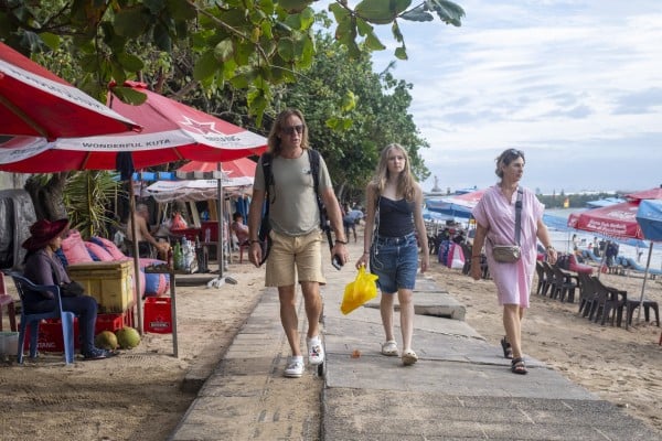 Tourists walk through a shopping area in Kuta, Bali, Indonesia. Photo: EPA Tourists walk through a shopping area in Kuta, Bali, Indonesia. Photo: EPA
