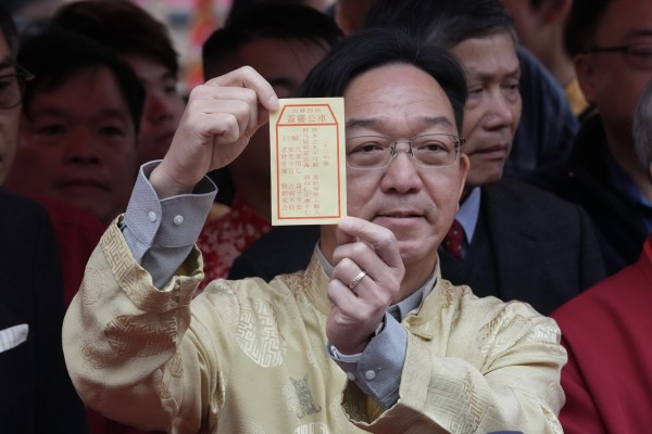 Kenneth Lau has drawn a “neutral” stick for Hong Kong at Che Kung Temple in Sha Tin on the second day of the Year of the Horse. Photo: Jelly Tse Kenneth Lau has drawn a “neutral” stick for Hong Kong at Che Kung Temple in Sha Tin on the second day of the Year of the Horse. Photo: Jelly Tse