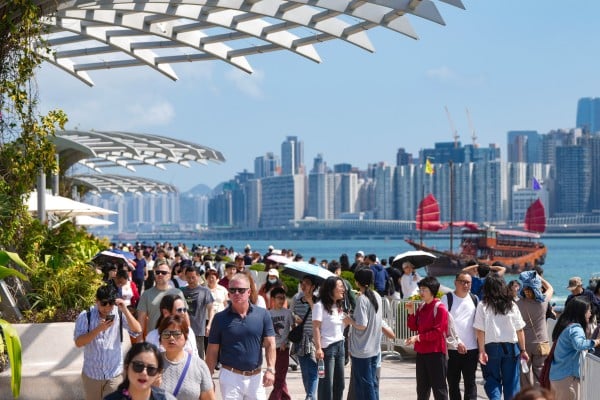 Tourists crowd the harbourfront in Tsim Sha Tsui. Photo: Sam Tsang Tourists crowd the harbourfront in Tsim Sha Tsui. Photo: Sam Tsang