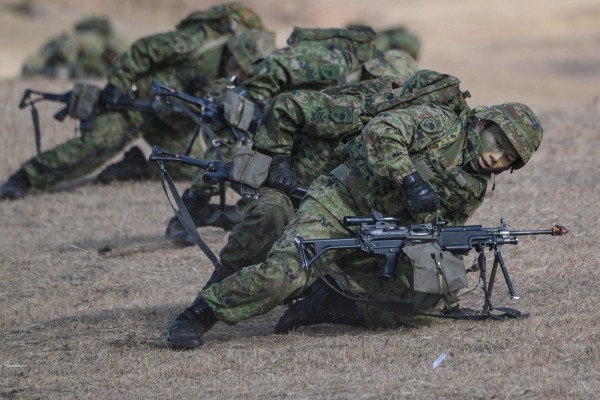 Japanese troops take position during a joint military exercise in 2024. Photo: AFP