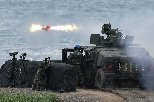Taiwanese soldiers launch a US-made tube-launched, optically tracked, wire-guided (TOW)-2A missile from a M1167 TOW carrier vehicle at the Fangshan training grounds in Pingtung on August 26, 2024. Photo: Reuters