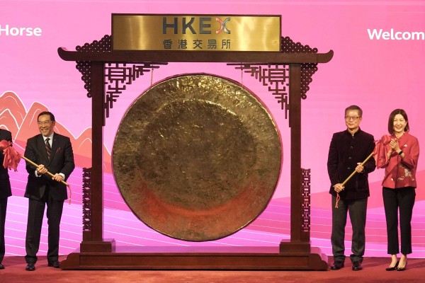 (From left) HKEX chairman Carlson Tong, Financial Secretary Paul Chan and HKEX CEO Bonnie Chan attend the Lunar New Year market opening ceremony at the stock exchange on Friday. Photo: Karma Lo
