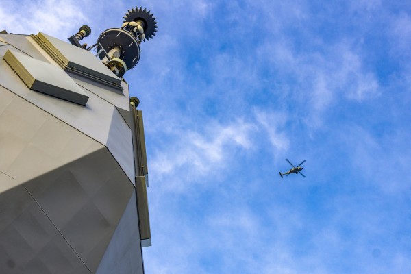 A Royal Australian Navy helicopter flies above the HMAS Toowoomba as it sails in the South China Sea. Photo: Handout