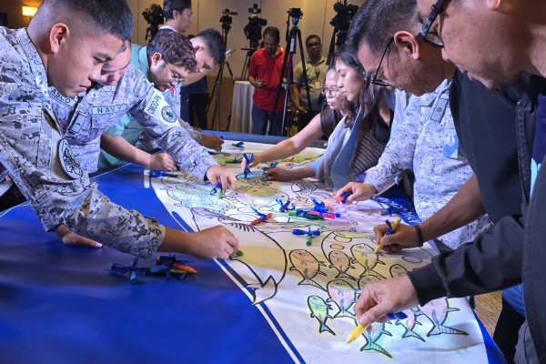 Members of the Philippine Navy take part in a collaborative colouring activity during the launch of the nationwide mural contest on February 10. Photo: Raissa Robles 