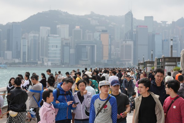 Tourists enjoy the harbourfront in Tsim Sha Tsui. Photo: Sam Tsang Tourists enjoy the harbourfront in Tsim Sha Tsui. Photo: Sam Tsang