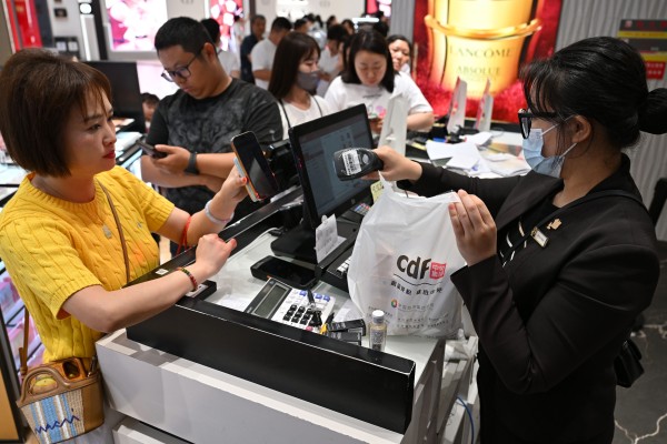 Customers check out at a duty-free store during the Spring Festival holiday in Haikou in Hainan province, as the IMF issues an urgent recommendation to China. Photo: Xinhua