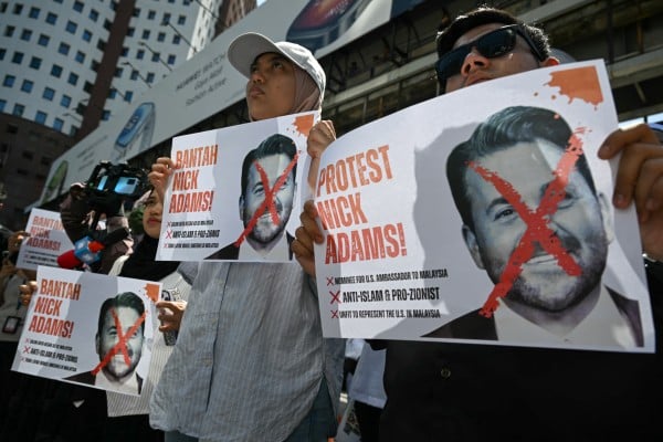 Malaysians protest outside the US embassy in Kuala Lumpur on July 18 last year against the proposed appointment of Nick Adams as ambassador to the country. Photo: AFP Malaysians protest outside the US embassy in Kuala Lumpur on July 18 last year against the proposed appointment of Nick Adams as ambassador to the country. Photo: AFP