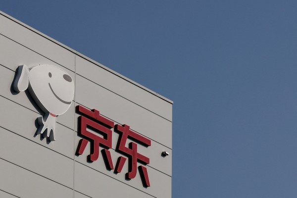 The JD.com logo is seen outside its sorting centre building in Beijing,  November 11, 2025. Photo: Reuters
