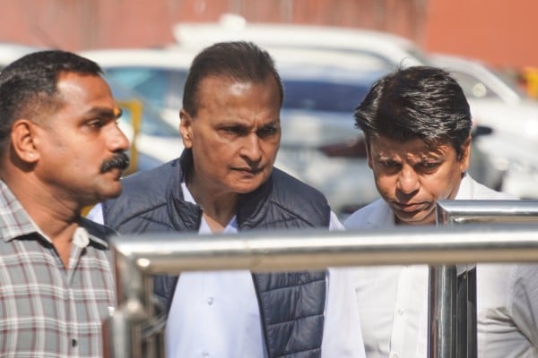 Indian industrialist Anil Ambani (centre) appears before the Enforcement Directorate in New Delhi on Thursday. Photo: AP Indian industrialist Anil Ambani (centre) appears before the Enforcement Directorate in New Delhi on Thursday. Photo: AP