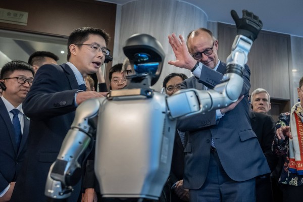 German Chancellor Friedrich Merz is given a tour of Unitree by CEO Wang Xingxing. Photo: DPA
