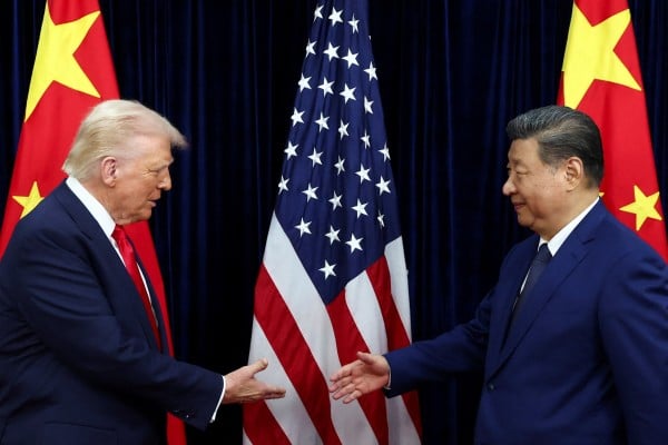 US President Donald Trump and President Xi Jinping shake hands at an October meeting in South Korea. The two are expected to meet again in four weeks. Photo: Reuters