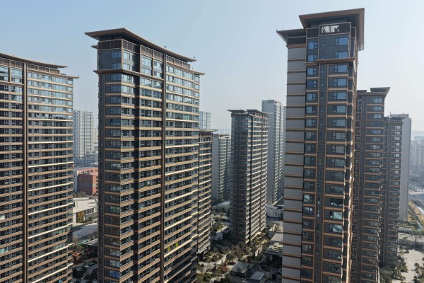 Calls to ‘accelerate the development of a new model for real estate’ have featured prominently in government work reports. Pnoto: AFP