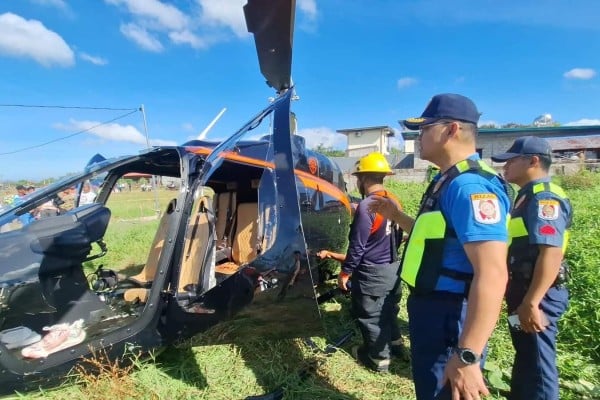 Police officers inspect the wreckage of a helicopter that crashed in Rizal on Tuesday. Photo: Rizal Provincial Police Office Police officers inspect the wreckage of a helicopter that crashed in Rizal on Tuesday. Photo: Rizal Provincial Police Office