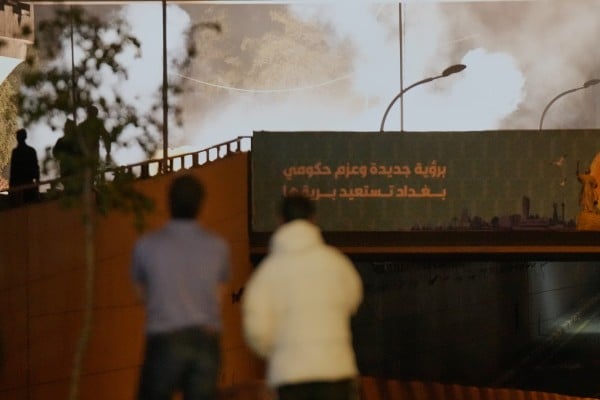 Security forces fire tear gas to disperse a protest against US and Israeli attacks on Iran, at a bridge leading to the fortified Green Zone where the US embassy is located, in Baghdad, Iraq, on March 2. Photo: AP Security forces fire tear gas to disperse a protest against US and Israeli attacks on Iran, at a bridge leading to the fortified Green Zone where the US embassy is located, in Baghdad, Iraq, on March 2. Photo: AP