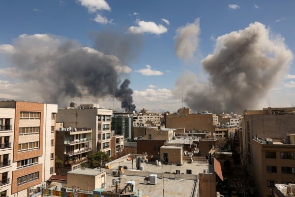 Smoke rises following an explosion in Tehran. Photo: WANA via Reuters Smoke rises following an explosion in Tehran. Photo: WANA via Reuters