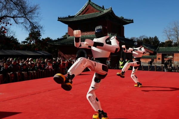 People watch as robots perform a dance during Lunar New Year celebrations in Beijing on February 18. Photo: Reuters People watch as robots perform a dance during Lunar New Year celebrations in Beijing on February 18. Photo: Reuters