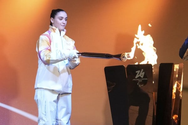 Torchbearer Matilde Villa lighting the cauldron during the Milano-Cortina 2026 Paralympics torch relay in Venice, Italy on Wednesday. Photo: Xinhua Torchbearer Matilde Villa lighting the cauldron during the Milano-Cortina 2026 Paralympics torch relay in Venice, Italy on Wednesday. Photo: Xinhua