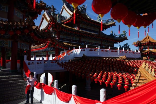 A tourist takes a selfie at the decorated Thean Hou Temple in Kuala Lumpur, Malaysia, last month. Photo: Reuters A tourist takes a selfie at the decorated Thean Hou Temple in Kuala Lumpur, Malaysia, last month. Photo: Reuters