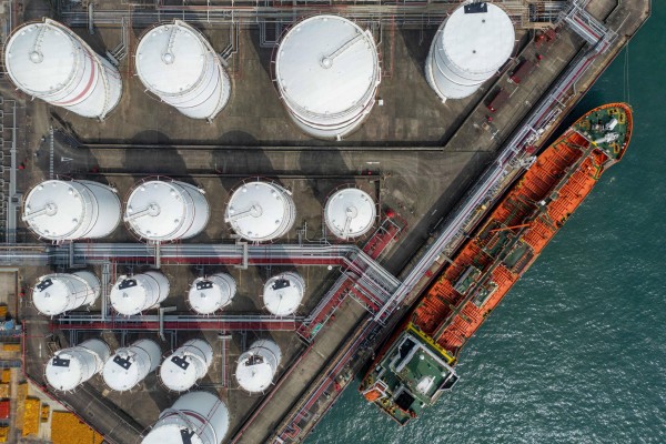 An oil tanker docked next to storage tanks in Hong Kong. Photo: dpa
