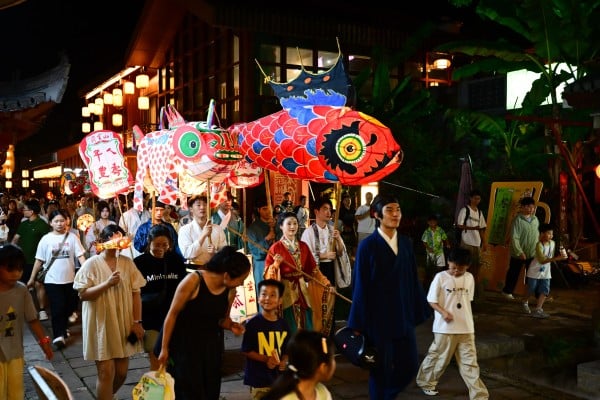 People take part in a lantern parade in Xiuning county, Huangshan city, Anhui province on August 29, 2025. The central government could assess cadres through periodic surveys of the satisfaction of the local populace. Photo: Xinhua
People take part in a lantern parade in Xiuning county, Huangshan city, Anhui province on August 29, 2025. The central government could assess cadres through periodic surveys of the satisfaction of the local populace. Photo: Xinhua