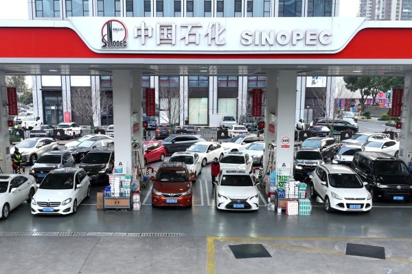 Vehicles refuel at a petrol station in Changzhou, Jiangsu province, on Monday ahead of an increase in petrol and diesel prices that came into effect on Tuesday. Photo: Xinhua