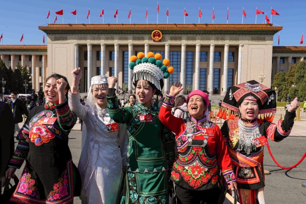 Ethnic minority delegates leave a plenary session of the National People’s Congress (NPC) held at the Great Hall of the People in Beijing on Monday. Photo: AP