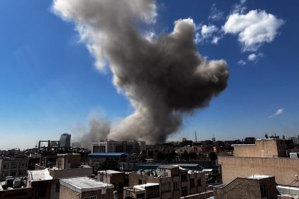 Plumes of smoke rise over Tehran, Iran, on March 1. Photo: Mowj/Middle East Images/AFP via Getty Images/TNS Plumes of smoke rise over Tehran, Iran, on March 1. Photo: Mowj/Middle East Images/AFP via Getty Images/TNS
