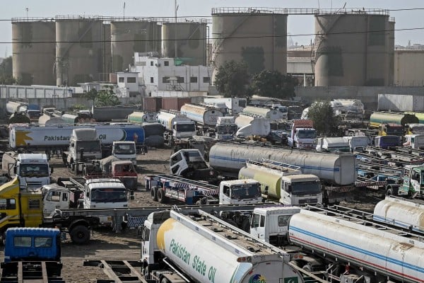 Oil tanker trucks stand parked near an oil storage terminal in Karachi on Thursday as global energy markets face disruptions amid ongoing conflict in the Middle East. Photo: AFP Oil tanker trucks stand parked near an oil storage terminal in Karachi on Thursday as global energy markets face disruptions amid ongoing conflict in the Middle East. Photo: AFP