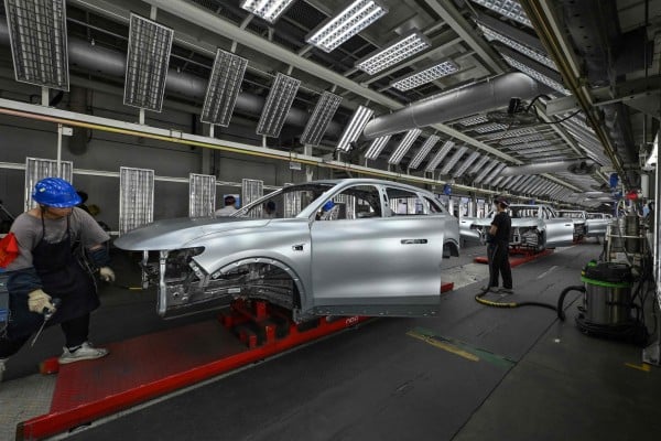 Employees work on an EV production line at the Leapmotor factory in Jinhua, Zhejiang province. Photo: AFP Employees work on an EV production line at the Leapmotor factory in Jinhua, Zhejiang province. Photo: AFP