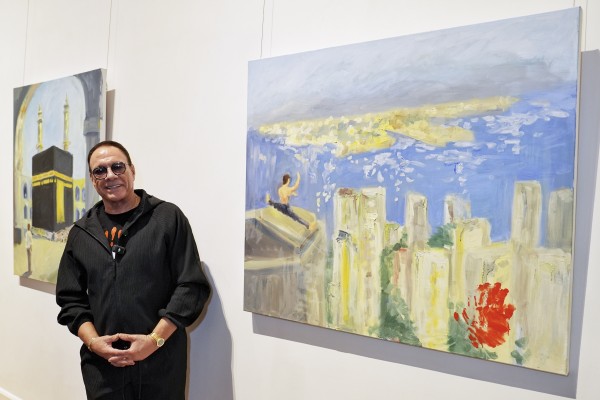 Jean-Claude Van Damme with his artworks in an exclusive painting vernissage of his city-themed oil paintings in Hong Kong at the University Museum and Art Gallery of the University of Hong Kong on March 7, 2026. Photo: Elson Li