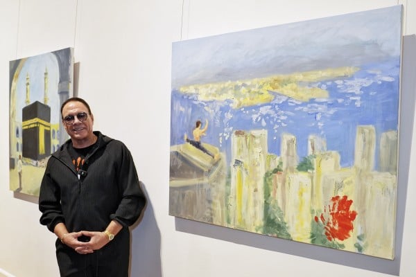 Jean-Claude Van Damme with his artworks in an exclusive painting vernissage of his city-themed oil paintings in Hong Kong at the University Museum and Art Gallery of the University of Hong Kong on March 7, 2026. Photo: Elson Li Jean-Claude Van Damme with his artworks in an exclusive painting vernissage of his city-themed oil paintings in Hong Kong at the University Museum and Art Gallery of the University of Hong Kong on March 7, 2026. Photo: Elson Li