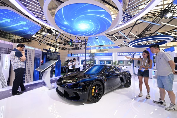 Visitors look at a new-energy sports car at an expo in Tianjin. Photo: Xinhua