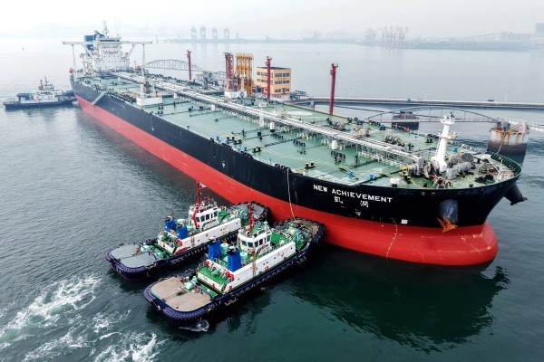 An oil tanker is guided to a berth at a port in Qingdao, Shandong province. China has oil reserves of 1.3 billion barrels, enough for four months of supply, according to UBS Group and S&P Global. Photo: AFP