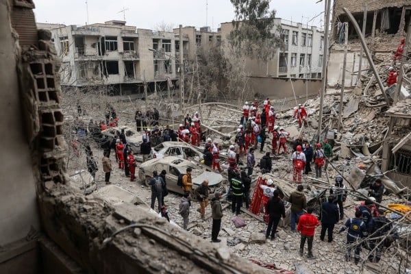 Emergency personnel work at the site of a strike on a residential building, in Tehran on March 16. Photo: via Reuters Emergency personnel work at the site of a strike on a residential building, in Tehran on March 16. Photo: via Reuters