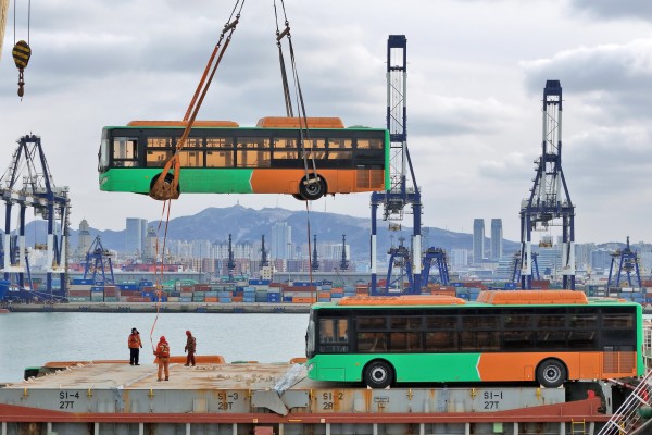 Natural gas-powered buses bound for Mexico are loaded onto a ship at Yantai Port in east China’s Shandong province. Photo: Xinhua