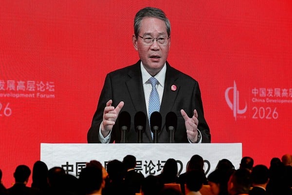 Chinese Premier Li Qiang is displayed on a large screen live broadcasting his speech at the opening of the China Development Forum held at the Diaoyutai State Guesthouse in Beijing on March 22. Photo: AP Chinese Premier Li Qiang is displayed on a large screen live broadcasting his speech at the opening of the China Development Forum held at the Diaoyutai State Guesthouse in Beijing on March 22. Photo: AP