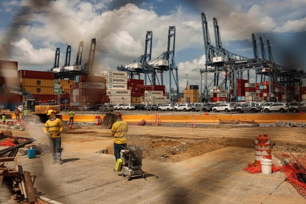 People work on a construction project at the Port of Balboa, managed by Hong Kong’s CK Hutchison Holdings, at the entrance to the Panama Canal in February. Photo: AFP People work on a construction project at the Port of Balboa, managed by Hong Kong’s CK Hutchison Holdings, at the entrance to the Panama Canal in February. Photo: AFP